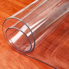 a clear plastic tube sitting on top of a wooden table