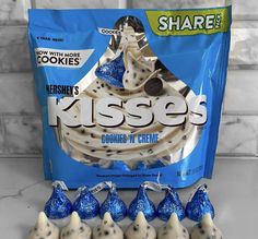 blue and white cookies are in front of a bag