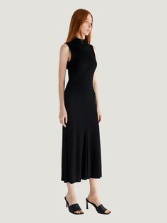 The All Row Josey Turtleneck Midi Dress, a silhouette that effortlessly marries classic elegance with modern flair. Designed to embrace and enhance your figure, this dress features a sophisticated turtleneck and a sleeveless, fit-and-flare draped bodice that makes a stylish statement. The Josey Dress is your go-to piece for transitioning seamlessly from the office to an evening affair. Paired with knee-high boots, it encapsulates the essence of fall fashion while promising year-round versatility. Additional Details: Product Type: Midi Dress Color: Black Material: High-quality fabric with stretch for comfort and fit Care: Machine washable for easy care Design: Sleeveless turtleneck with a fit-and-flare silhouette for a flattering drape Occasion: Perfect for workwear, special occasions, or a Elegant High Neck Sleeveless Formal Dress, Elegant High Neck Sleeveless Dress For Evening, Fitted High Neck Sleeveless Dress For Formal Occasions, Fitted High Neck Sleeveless Dress For Formal Events, Classic High Neck Formal Dress, Elegant High Neck Dress With Flattering Silhouette, Elegant Turtleneck Midi Dress For Work, Classic High Neck Dress For Workwear, Elegant Turtleneck Dress For Work