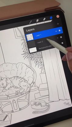 a person is drawing on an ipad with a pen