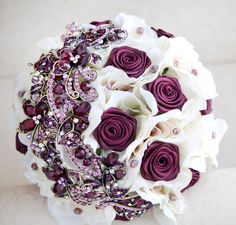 a bridal bouquet with purple and white flowers