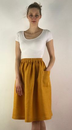 "Write the selected color in the message Handmade mustard linen midi skirt with зatch pockets on the sides, elastic waistband, perfect for casual wear and suitable for any occasion in any season Details: - 100% natural linen produced in Europe ; - medium weight (180 gram per square meter); - color: mustard, could be any from our colors catalog (color samples at the photo); Made to order, approximately a few days, If you have any questions please message me and I will be glad to answer. Size guid Everyday Summer Skirt With Pockets, Summer Day Out Skirt With Side Pockets, Everyday Summer Skirt With Elastic Waistband, Summer Skirt With Pockets For Day Out, Flowy Everyday Midi Skirt, Everyday Flowy Midi Skirt, Casual Summer Maxi Skirt With Side Pockets, Yellow Summer Maxi Skirt With Elastic Waistband, Linen Skirt With Elastic Waistband For Day Out