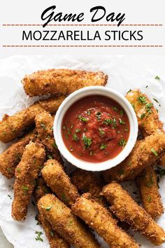 fried mozzarella sticks with tomato sauce and parsley on the side for dipping