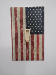 an american flag light switch cover on a white wall