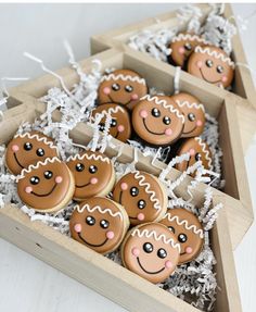 several decorated ginger cookies in a wooden box