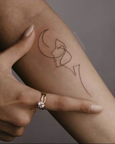 a woman's arm with a small tattoo on the left side of her arm