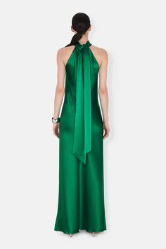 An elegant high neckline and sash-tie neckline, coupled with draping bias-cut satin, cement its place as a time-honoured favourite. Emerald Gown, Halter Neck Gown, Galvan London, Bridal Jumpsuit, Bias Cut Dress, London Dress, Bridal Separates, London Outfit, Cut Dress