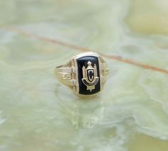 14K Yellow Gold Chelmsford High School Class Ring, 1937, black onyx stone, size 9.25, weight 6.7 grams Stock # BB86R35 This listing contains photographs of the actual item you will receive. Our items are in excellent condition with little or no signs of wear and many are one of a kind pre-owned estate finds. Please look closely at the pictures in this listing as they are part of the product description. Please read the description, as any imperfections or condition comments will be included. We Vintage Class Rings, Vintage Yellow Gold Monogram Rings, Class Rings High School Reeds Jewelers, 1990 Class Ring, Baylor University Class Ring, Class Rings High School, High School Classes, Claddagh Rings, Black Onyx Stone