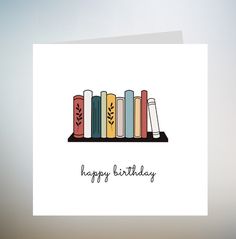 a happy birthday card with books on a shelf