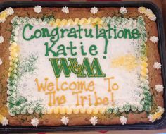 a cake with congratulationss written on it in the shape of a welcome to the tribe