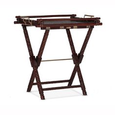 a small wooden table with two trays on it's legs and an ironing board attached to the top