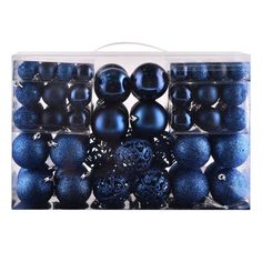 black and blue ornaments in a clear box