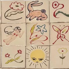 nine tiles with different designs on them in the shape of animals and flowers, each depicting an individual's face