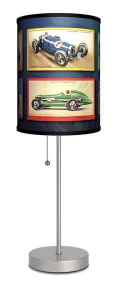 a lamp that is sitting on top of a metal base and has an image of a racing car painted on it