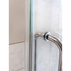 an image of a glass door handle on the outside of a shower stall or tub