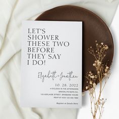 a card with the words, let's shower these two before they say i do