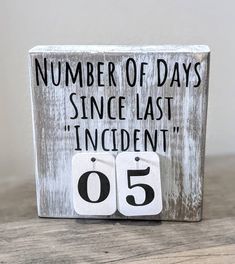 a wooden block with the words number of days since last'incident'written on it