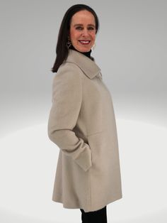 Rendered in luxurious Baby SURI Alpaca and Merino Wool, the coat is sumptuously supple and fits to flatter. Designed by one of Peru's finest coat makers, the coat drapes wonderfully for a perfectly feminine fit. It's mid-length enhances its versatility, so it can easily transition from a day-to-night look. STYLING Casual Styling Wear over your favorite jeans and tee for everyday elegance with minimal effort and fuss. Office Wear Power through a presentation or meeting with this rich wrap coat. T Elegant Long Sweater Coat For Formal Occasions, Elegant Cream Wool Coat With Notch Lapel, Elegant Long Wool Outerwear, Elegant Sweater Coat For Formal Occasions, Elegant Long Fitted Sweater Coat, Elegant Cream Pea Coat For Formal Occasions, Elegant Beige Wool Coat With Concealed Placket, Elegant Beige Long Coat, Elegant Long Beige Coat