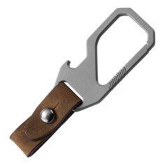 a bottle opener with a brown leather strap and metal clip on the front, open