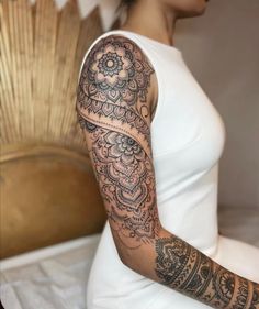 a woman with a tattoo on her arm