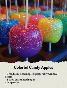 colorful candy apples are lined up on sticks