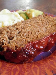 a plate with meatloaf, mashed potatoes and vegetables on it that says amish meatloaf