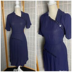 "1940's navy blue shirt sleeve dress with two rows of asymmetrical buttons. Also has an asymmetrical back collar. Metal side zipper, very structurally sound but has a few small holes/scrapes on the butt and a couple on the center bodice as well, see photos Bust: 40\" Waist: 32\" Hips: 42\" Skirt length: 27\"" Fitted Button-up Vintage Dress With Buttons, Fitted Vintage Button-up Dress, Vintage Semi-formal Dresses With Buttons, Navy Fitted Collared Dress, Navy Fitted Vintage Dress, Navy Vintage Short Sleeve Dress, Navy Vintage Dresses With Buttons, Navy Vintage Dress With Buttons, Navy Formal Dress With Button Closure