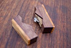 a couple of pieces of wood sitting on top of a wooden table