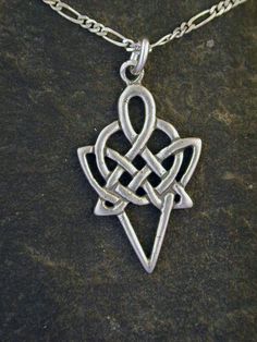 This Celtic Knot Spear Point pendant is Sterling Silver. The included chain is a Sterling Silver Figaro 50 chain. You may choose 16, 18 or 20 inch at the same price. Other length available at sightly higher prices. This Celtic Knot Spear Point pendant measures 1 3/8" long by 3/4" across. I hand cast all my pieces using the lost wax casting method. Please ask your needs. You may call me with questions, often I am out so please use my machine. 831-476-3176. Satisfaction Guaranteed!I send items USP Symbolic Silver Pendant Chain Necklace, Symbolic Pendant Chain Necklace With Adjustable Chain, Symbolic Silver Chain Necklace As Gift, Silver Symbolic Chain Necklace As Gift, Jewelry Advice, Wax Casting, Lost Wax Casting, Celtic Jewelry, Lost Wax