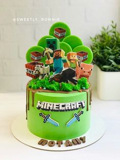 a green cake decorated with minecraft characters