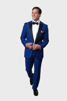 The cut of this blue tuxedo is such that it can be worn to semi-formal and formal events. The jacket is single breasted and has a single button closure. It features a traditional lapel width with a high-cut peak and is satin faced. The jacket length comes to just below the hips and has a lightly tailored cut. Pleated front pants have a satin waistband and a straight cut leg. Details: Includes: Tuxedo Jacket, and Pants JACKET: Full Lined,1 Button closure, Satin Peak Lapel. Side Vents PANTS: Flat Classic Royal Blue Tuxedo With Notch Lapel, Royal Blue Tuxedo Suit For Party, Royal Blue Notch Lapel Tuxedo For Wedding, Royal Blue Notch Lapel Blazer For Formal Occasions, Classic Royal Blue Tailored Tuxedo, Formal Royal Blue Notch Lapel Blazer, Classic Three-piece Suit With Notch Lapel In Royal Blue, Classic Blue Three-piece Suit With Single Button, Classic Three-piece Suit In Royal Blue With Notch Lapel