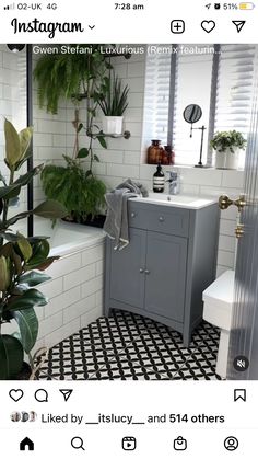 the bathroom is decorated in white and grey with black and white floor tiles on the walls