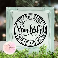 a glass block that says it's the most wonderful time of the year