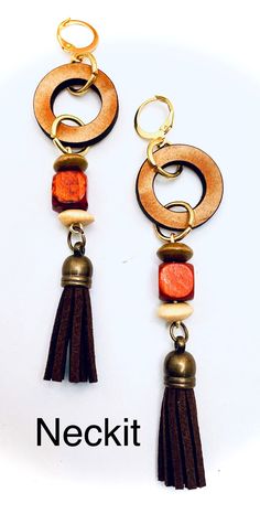 "Wood rounds and bead accents. Hangs 2 1/2\". Chocolate colored suede tassels. Gold findings." Suede Tassel, Chocolate Color, Business Idea, Milwaukee Wi, Wood Rounds, Wooden Earrings, Wood Earrings, Etsy Earrings Dangle, Jewelry Inspo