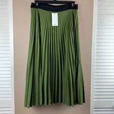 Nwt Pleated Skirt In Olive Green With Black Waistband. Side Zipper. Polyester Waist-14”, Length-31”. Green Stretch Maxi Skirt With Pleats, Green Stretch Pleated Maxi Skirt, Green Pleated Stretch Maxi Skirt, Spring Green Stretch Pleated Skirt, Green Stretch Pleated Skirt For Spring, Green Pleated Skirt For Work, Green Flowy Pleated Skirt For Work, Black Green, Pleated Skirt