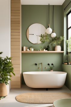 Step into tranquility with this Japandi bathroom retreat. The soft green walls, minimalist fixtures, and natural decor elements create a soothing and elegant space. The freestanding tub and lush plants add a touch of nature, perfect for unwinding. #JapandiBathroom #TranquilRetreat #GreenDecor #MinimalistDesign Soothing Bathroom Ideas, Peach Green Bathroom, Spa Vibes Bathroom, Japandi Interior Design Bathroom, Green Washroom, Small Green Bathroom Ideas, Green And Wood Bathroom, Calming Bathroom Ideas