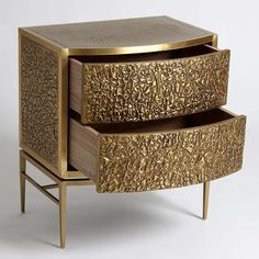 a golden cabinet with two drawers on one side and an open drawer on the other