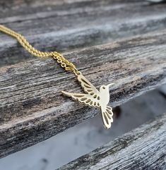 "This adorable necklace has a hummingbird charm. The metal is a gold color and you may choose the length of your necklace. This would make a great gift for a birthday, an anniversary, Christmas or any other occasion. Size: about 1\" wide x 1 1/8\" tall Metal: alloy, nickel free All jewelry items come in a gift box." Gold Necklace With Bird Design For Gift, Gold Necklace With Bird Design As Gift, Gold Hummingbird, Hummingbird Necklace, Petoskey Stone, Gift For Anniversary, Memory Locket, Christmas Gifts For Her, Locket Necklace