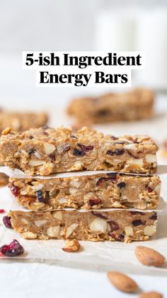 granola bars stacked on top of each other with almonds and cranberries