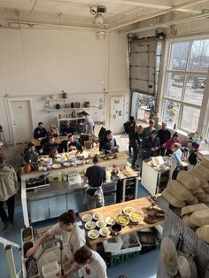 a group of people in a kitchen preparing food