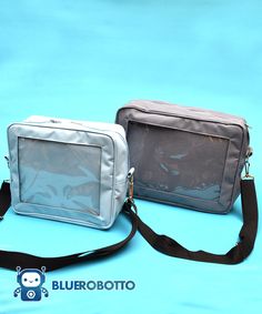 "IMPORTANT: All products are made to order. Orders take up to 4 weeks to be made and shipped. . Welcome to BlueRobotto .-.-.-.-.-.-.-.-.-. With this stylish messenger bag you can show off your fandom, your travel pics or even your pet photos everywhere you go. The front of the bag is transparent, with a window looking to the interior panel, where you can customize it however you like, place your pins, buttons, pictures, keychains and even small plushies. We used some safety pins and some tape to Rectangular Box Bag With Removable Pouch For School, Rectangular Camera Bag With Removable Pouch For Daily Use, Rectangular School Shoulder Bag, Large Capacity Rectangular Camera Bag For Daily Use, Rectangular Box Bag With Detachable Strap For School, School Shoulder Bag With Detachable Strap, Rectangular School Box Bag With Detachable Strap, Square Box Bag With Detachable Strap For School, School Briefcase With Removable Pouch