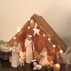 a nativity scene with figurines and lights