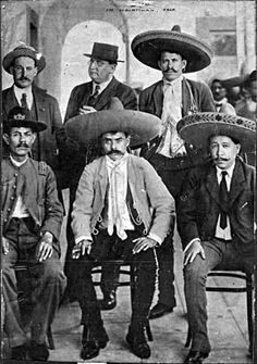 black and white photograph of men wearing sombreros