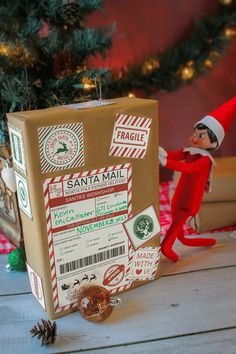 an elf is standing in front of a box