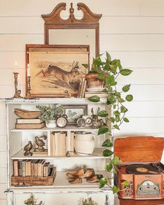 an old bookcase is filled with books and plants