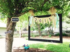 a large mirror hanging from the side of a tree