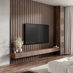 a large flat screen tv mounted to the side of a wall in a living room