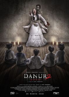 the poster for danur 2 is shown with an image of a woman surrounded by people