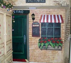 an entry way to a restaurant painted on the side of a brick building with flowers and potted plants