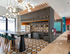 the inside of a restaurant with tables and chairs